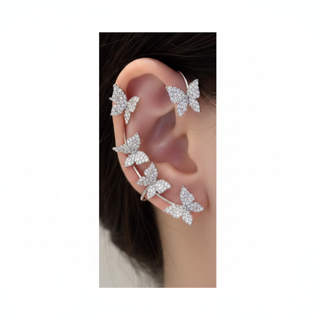 Butterfly ear cuff set on ear, white background