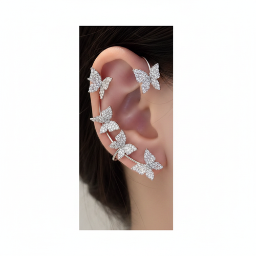 Butterfly ear cuff set on ear, white background