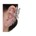 Crystal butterfly ear cuff on ear, white studio background