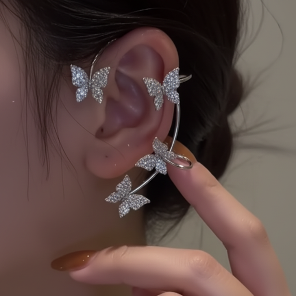 Butterfly ear cuff worn on ear, dark moody background