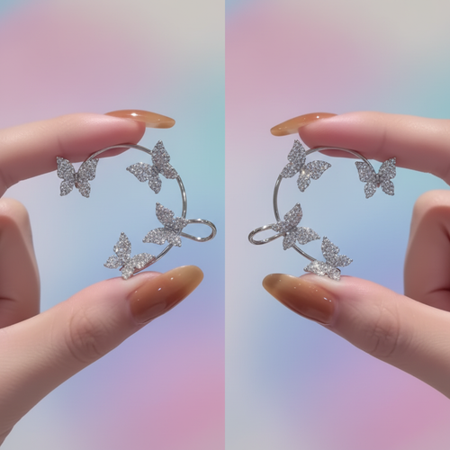 Butterfly ear cuff set held in hand, pastel background